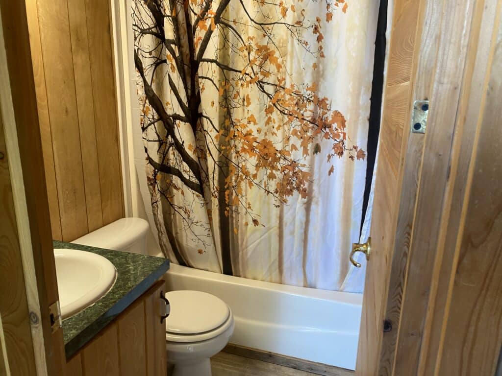 Bathroom inside deluxe cottage at Robin Hill Campground