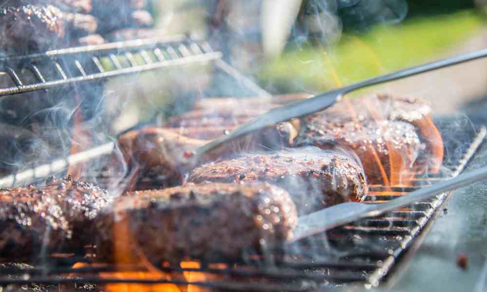 burgers cooking on griddle