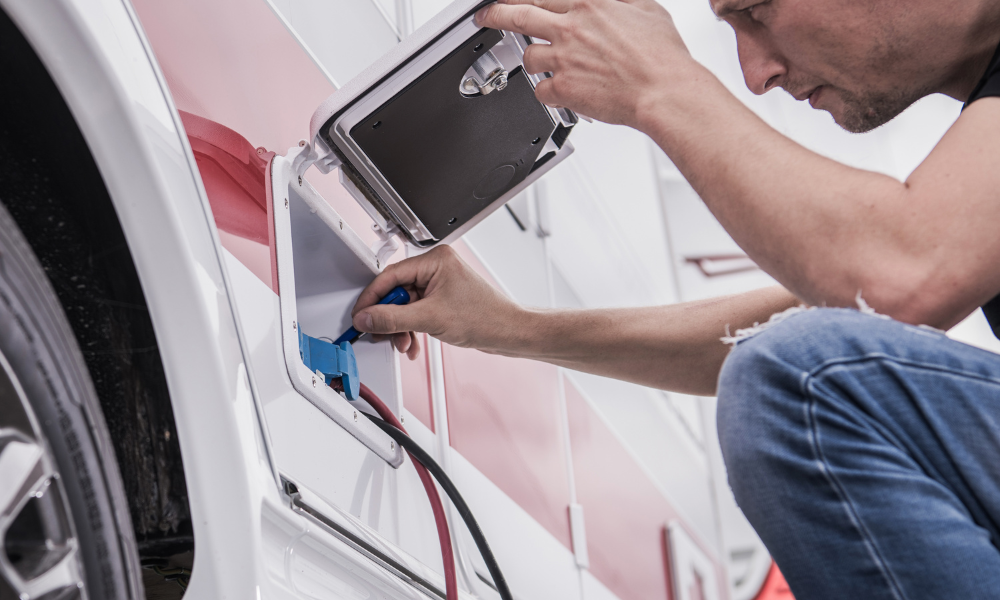 man checking the electrical connection of RV