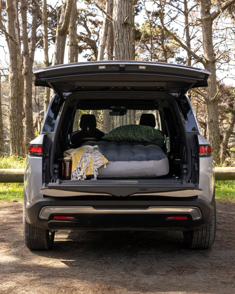 Rivian R1S with the hatch opened and mattress inside